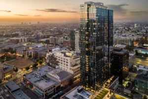 A stunning view of 1900 Broadway in Oakland at sunset, showcasing the modern architecture and vibrant urban landscape.