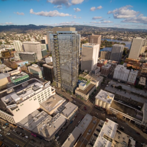 Aerial view of 1900 Broadway in Uptown Oakland, showcasing its modern architecture and prime location amidst the bustling city.