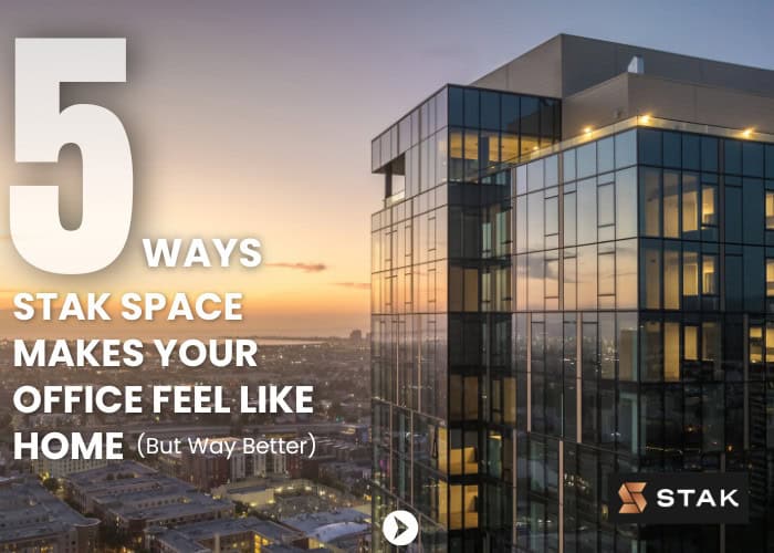 Modern glass building reflecting a stunning sunset in the city, symbolizing the luxurious and innovative workspaces at STAK Space.