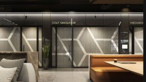 Luxury golf simulator and media room at STAK Space, offering high-end amenities for work and play.