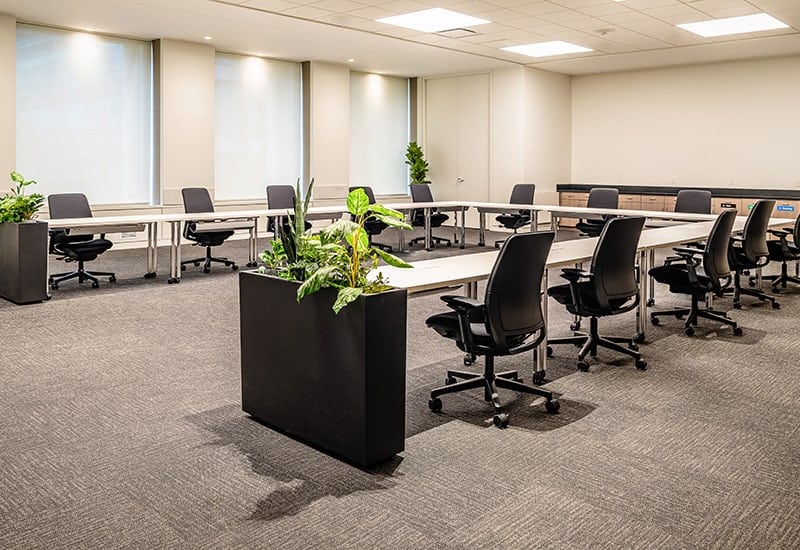 Bright coworking room with desks at STAK Space where virtual office members can use day passes