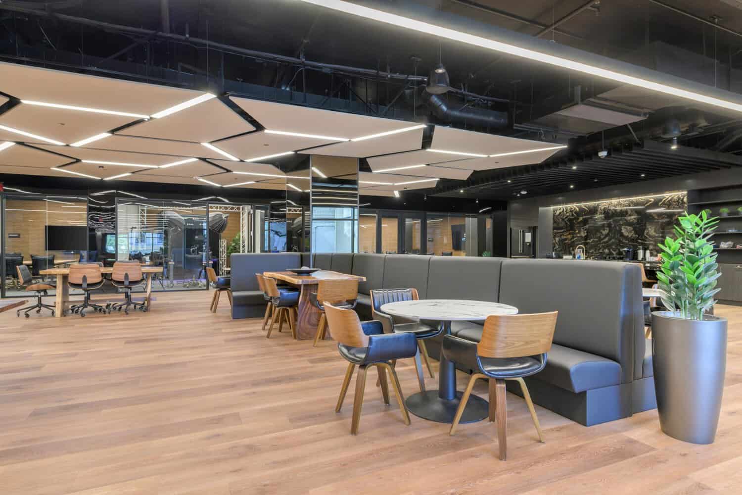 Freelancer coworking in Oakland: the coworking lounge with booths and work tables at STAK Space, 1920 Broadway