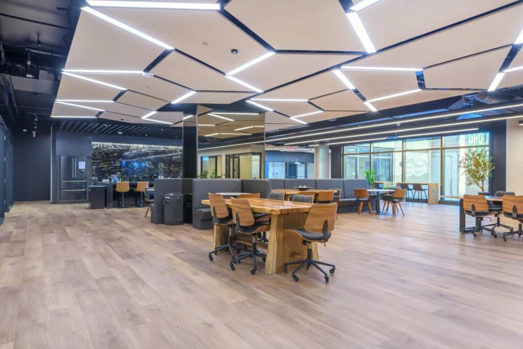 Open coworking floor with shared tables at STAK Space, 1920 Broadway in Oakland