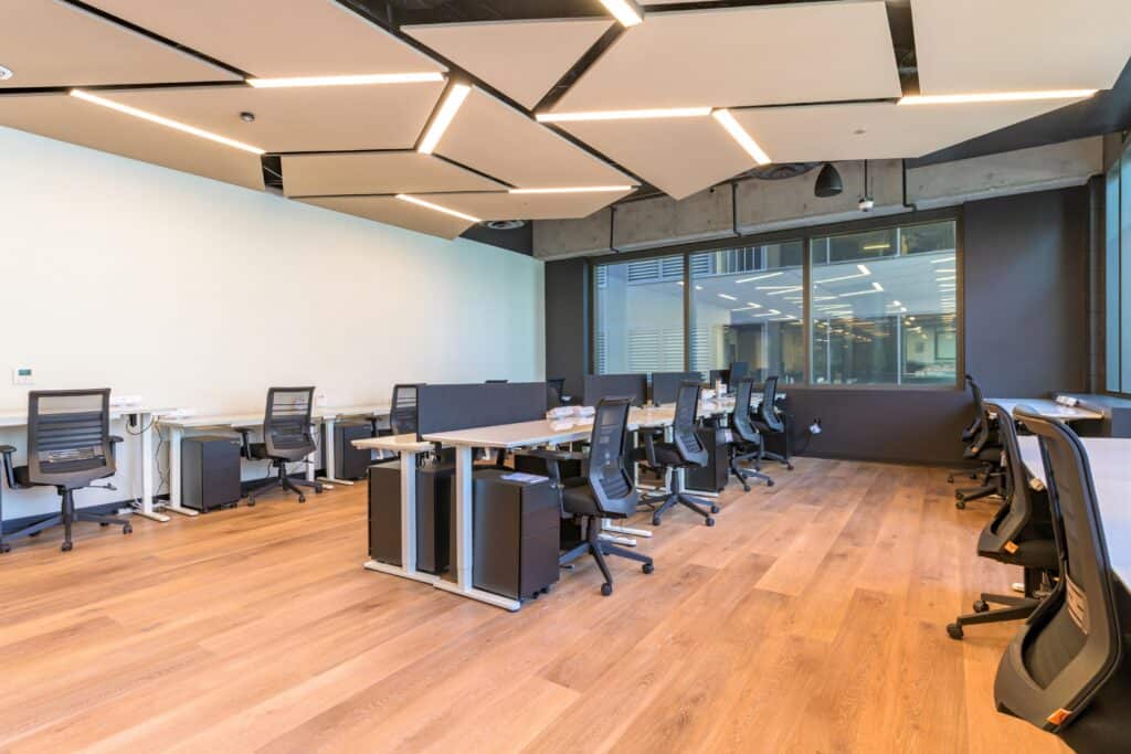 Desks with monitors set up in a small private office in Oakland