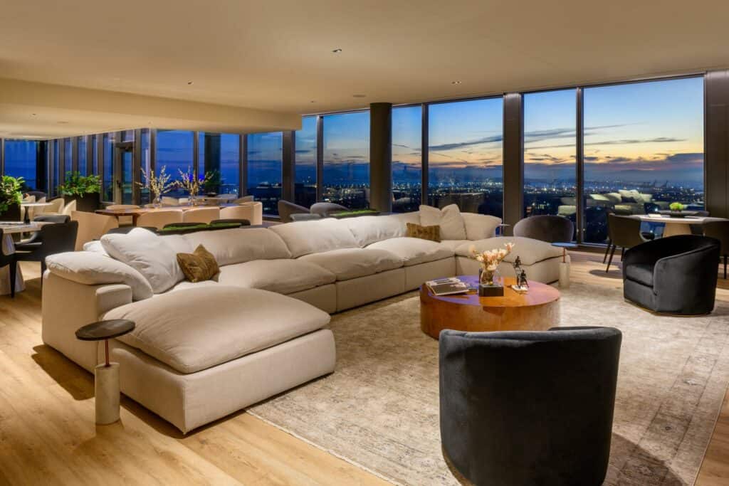 Penthouse lounge at 1900 Broadway with sunset views over Oakland
