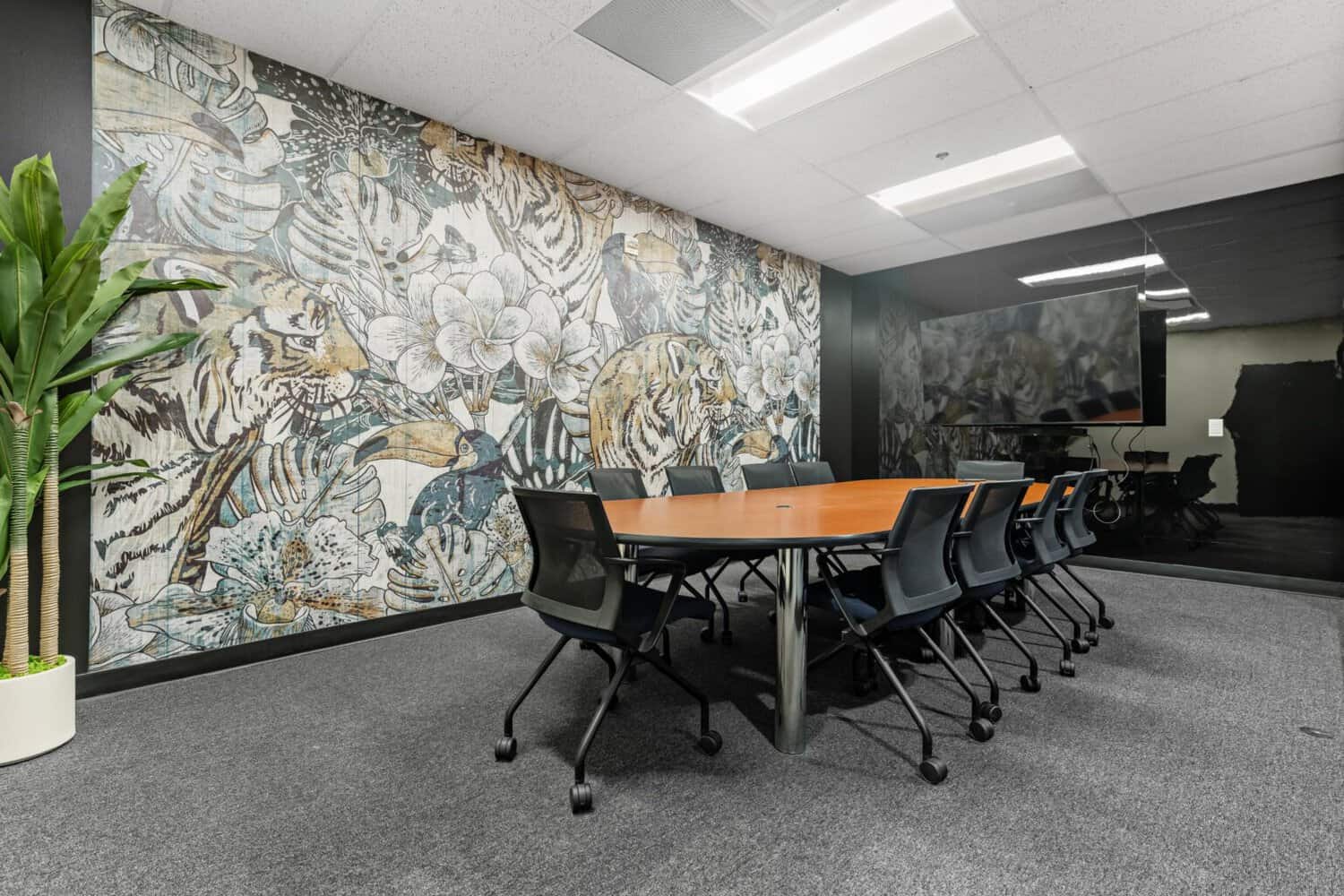 Conference room with mural wall and long table at 1950 Franklin