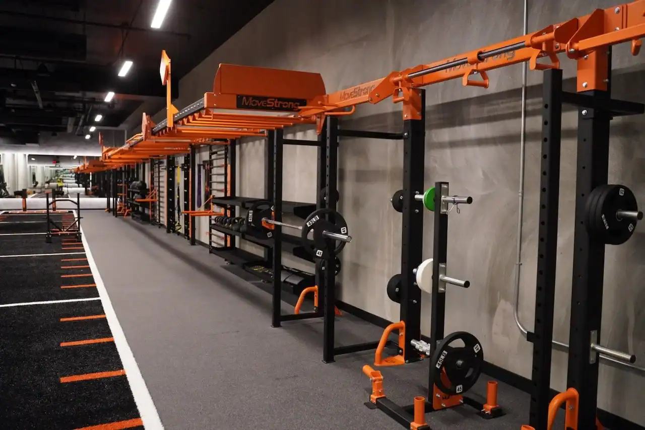 MoveStrong training rig with barbells and plates in the STAK Space fitness center in Oakland