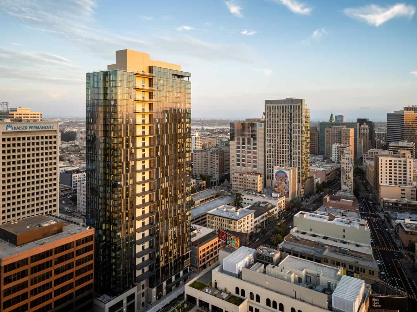 The 1900 Broadway residential tower in Uptown Oakland at golden hour
