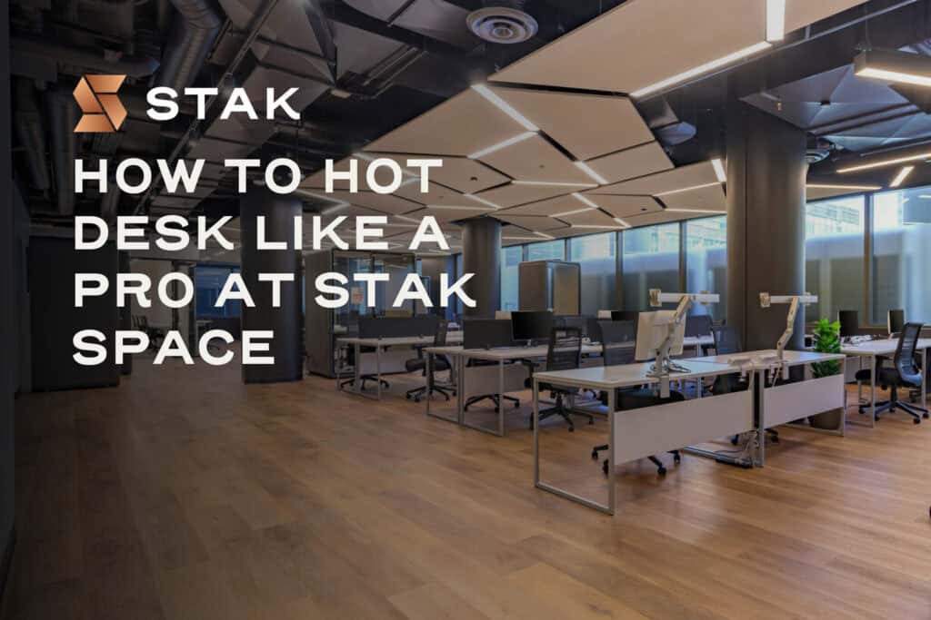 STAK hot desk guide graphic over an open coworking workspace.