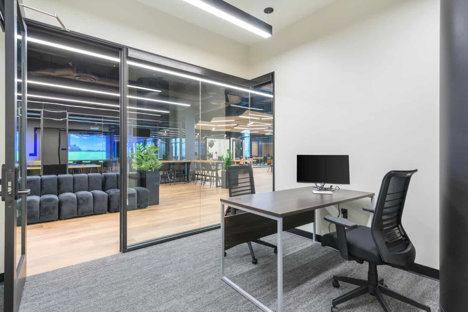 Glass-walled meeting room at STAK Space 1920 Broadway in Oakland