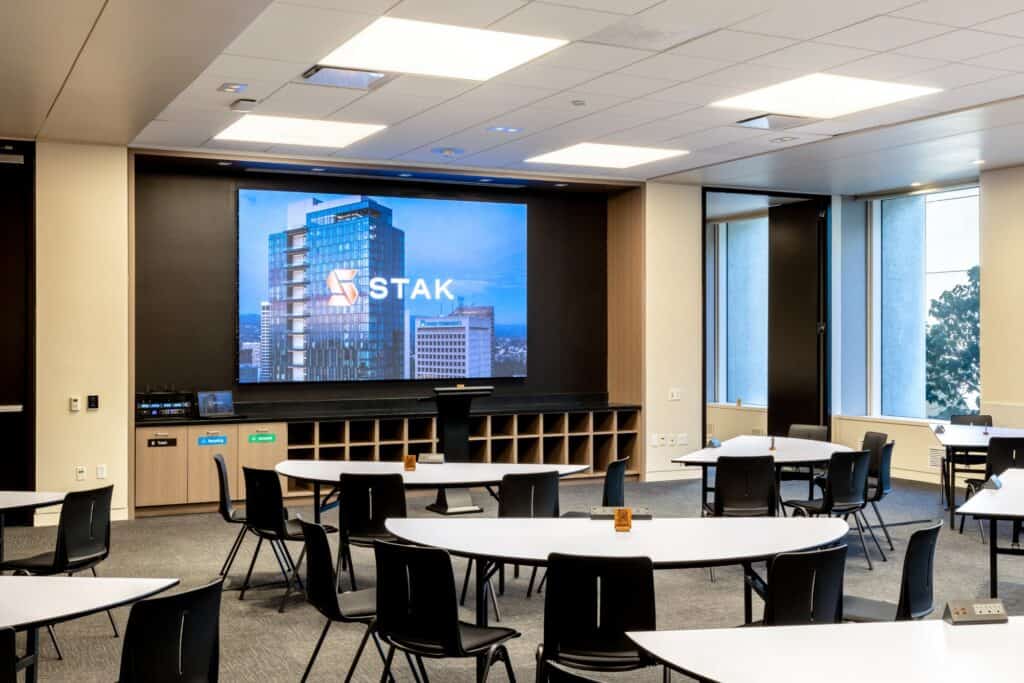 Conference room with a large screen for an executive meeting at STAK Space 1950 Franklin