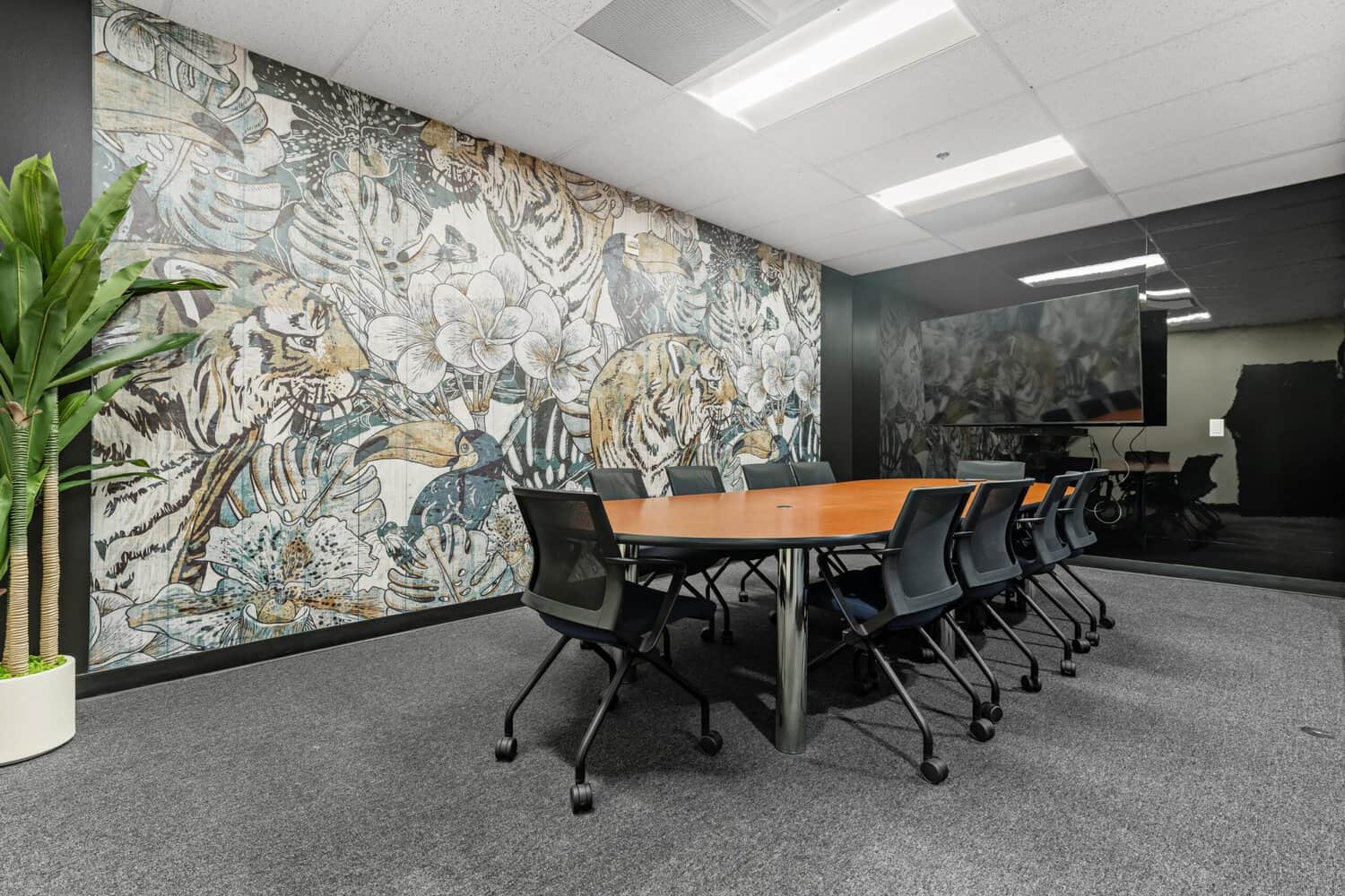 Eye of the Tiger conference room with jungle wallpaper on the 17th floor at 1950 Franklin