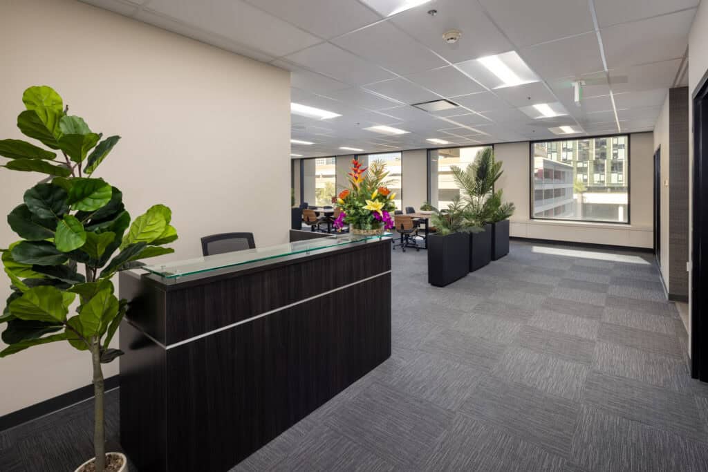 Reception desk and open office area in a Level 4 office suite at 1950 Franklin in Oakland