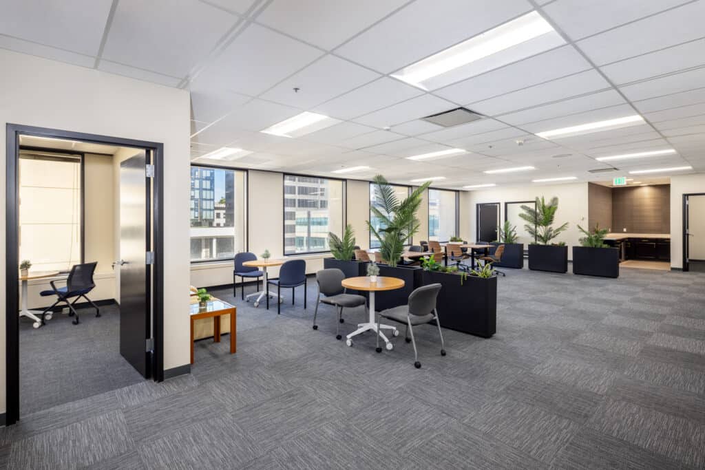 Bright open office with lounge seating and private offices on Level 4 at 1950 Franklin
