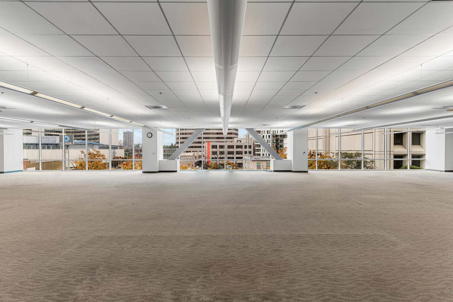 Wide-open empty office floor with floor-to-ceiling windows at 415 20th Street