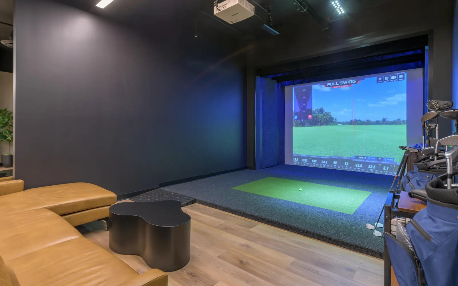 Golf simulator lounge at STAK Space, 1920 Broadway