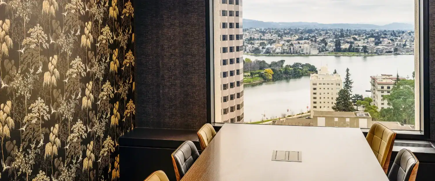 Conference table with a Lake Merritt view on the 18th floor of STAK Space at Franklin in Uptown Oakland